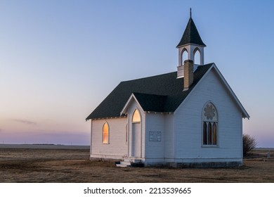 A Closeup Shot Of An Old Abandoned Church In A Field