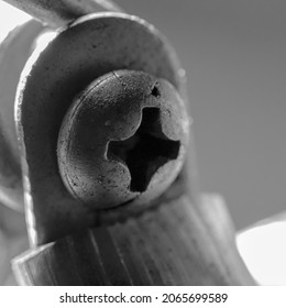 A closeup shot of an old screw head - Shutterstock ID 2065699589