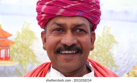 A Closeup Shot Of An Old South Asian Man Wearing A Traditional Costume