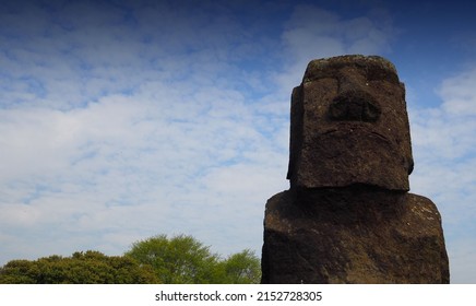 A Closeup Shot Of One Of The Easter Island Statues With The Cloudy Sky On The Background In Chile