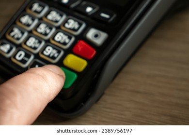 Closeup shot of a payment terminal keyboard, representing a banking concept.