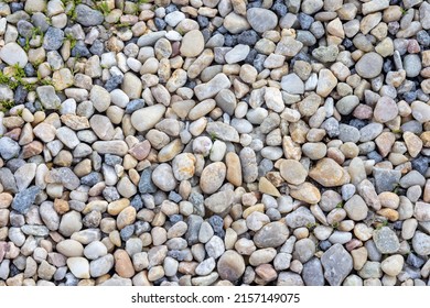 A closeup shot of pea gravel stones - Shutterstock ID 2157149075