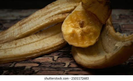 A close-up shot of a peeled and bitten Canarian banana