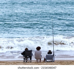 A Closeup Shot Of People Doing Fishing In The Sea On A Sunny Day