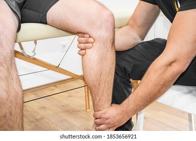 A closeup shot of a physiotherapist helping a patient with his knee - Shutterstock ID 1853656921