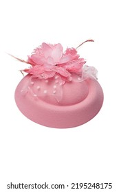 Close-up shot of a pink felt pillbox hat decorated with a flower, beads and feathers. The fascinator hat with an alligator clip is isolated on a white background. Front view. - Shutterstock ID 2195248175
