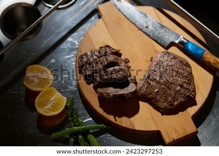 Close-up shot, a professional chef expertly prepares a delicious steak using modern cooking techniques, showcasing culinary excellence and precision in the art of gourmet cuisine