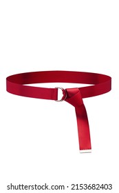 Close-up shot of a red textile belt without holes. The belt features a metal D-ring buckle and a metal tip. The textile belt is isolated on a white background. Front view.