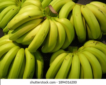 A Closeup Shot Of Ripe Bananas Stuck Together