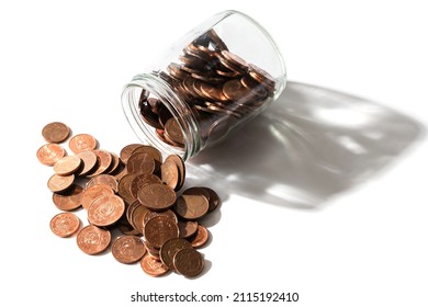 Closeup shot of a shiny copper euro coins spilled from a glass jar. - Powered by Shutterstock