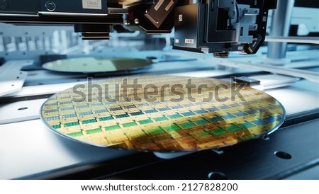 Close-up Shot of Silicon Wafer in Bright light at Advanced Semiconductor Foundry, that produces Computer Chips.