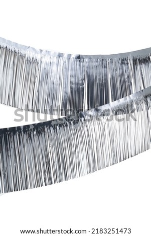 Close-up shot of a silver foil double sided curtain. The foil strip curtain for party or event is isolated on a white background. Front view.                               