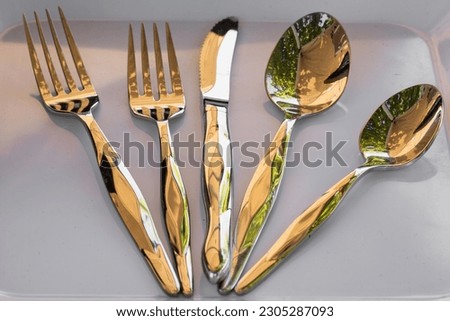 A close-up shot of silverware eating utensils on a plate