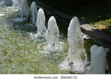 A Closeup Shot Of Small Water Fountains For Drinking In The Par