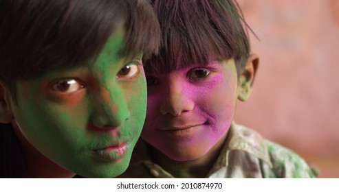 A Closeup Shot Of South Asian Children With Colorful Faces During The Indian Holi Festival