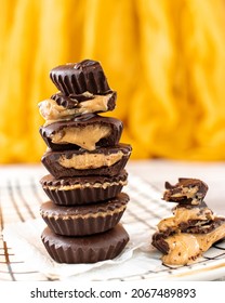 A Close-up Shot Of A Stack Of Homemade Dark Chocolate Peanut Butter Cups. 