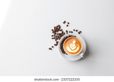 closeup shot of a steaming cup of hot coffee and beans on a pristine white background. The aromatic blend of dark roast coffee beans promises a delicious awakening to kickstart your day