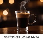 A close-up shot of a steaming hot black coffee served in a transparent glass mug placed on a wooden table. The rich, dark coffee has a layer of creamy froth on top, with visible steam rising