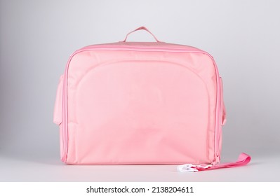 Closeup Shot Of Sterilizing Clean Hygienic Rubber Tip Baby Milk Bottle With Clear Plastic Cap Placed Inside Stretching Pocket Compartment Of Pink Utility Multifunction Multipurpose Zipper Fabric Bag