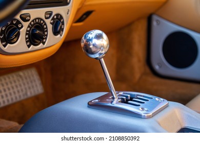 A Closeup Shot Of A Stick Shift In A Vintage Car