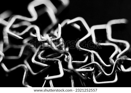 A closeup shot of surgery staples after removal isolated on black background