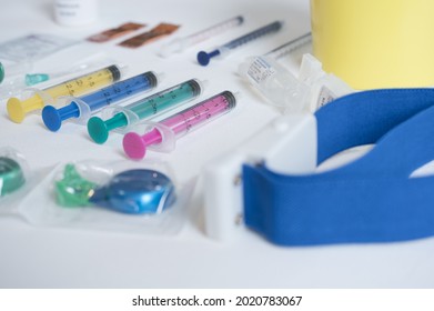 A closeup shot of syringes and a tourniquet
