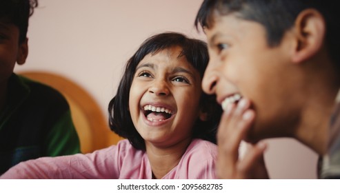 A Close-up Shot Of Three South Asian Kids Smiling