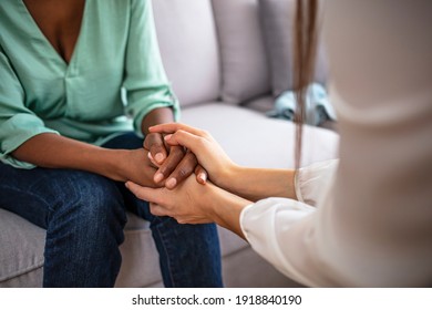 Closeup shot of two unrecognizable people holding hands in comfort. Be the person who helps the next. I'm here for you. Cropped shot of two unrecognizable people holding hands - Shutterstock ID 1918840190