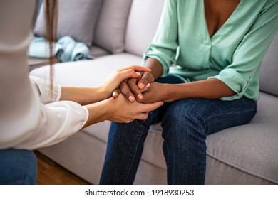 Closeup shot of two unrecognizable people holding hands in comfort. Be the person who helps the next. I'm here for you. Cropped shot of two unrecognizable people holding hands - Shutterstock ID 1918930253