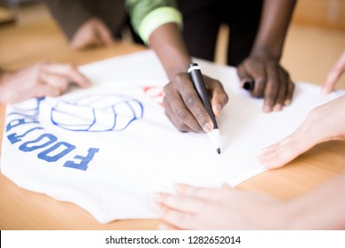 Close-up Shot Of Unrecognizable Football Team Captain Giving Autograph To Group Of Fans After Successful Completion Of Match