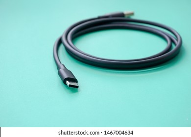 Closeup Shot Of USB Type C Cable On Turquoise Background