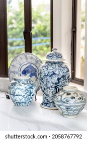 A Closeup Shot Of A Vintage Furniture And Kitchen Stuff Collection On The White Granite Table