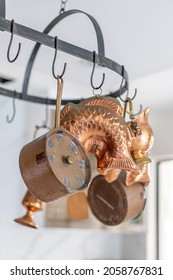 A Closeup Shot Of A Vintage Furniture And Kitchen Stuff Collection Holding On The White Top