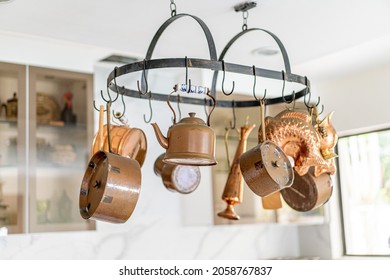 A Closeup Shot Of A Vintage Furniture And Kitchen Stuff Collection Holding On The White Top