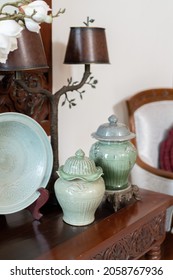 A Closeup Shot Of A Vintage Furniture And Kitchen Stuff Collection On The Brown Wooden Table