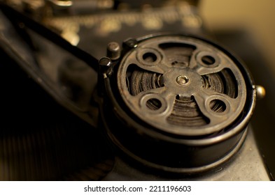 A Closeup Shot Of A Vintage Round Metal Belt Buckle With Blur Background