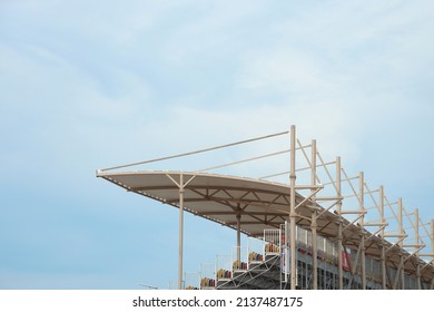 Close-up shot of VIP tribune with canopy under blue light sky