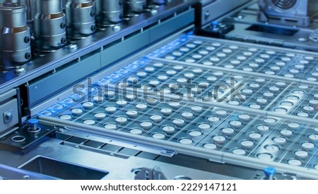 Close-up Shot of White Pills During Production and Packing Process on Modern Pharmaceutical Factory. Medical Drug Manufacturing.