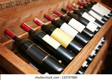 Closeup shot of wine shelf. Wine cellar.

