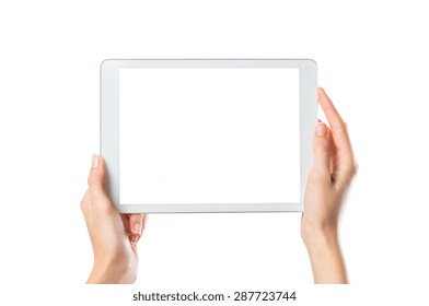 Closeup shot of woman hands holding digital tablet isolated on white background. Female hands holding a palmtop with white screen. Digital tablet with white display ready for your webpage or design.