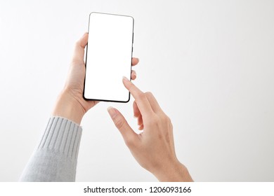 Closeup Shot Of A Woman Holding  Typing On Mobile Phone Isolated On White Background Blank Screen To Put It On Your Own Webpage Or Message