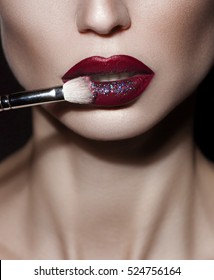 close-up shot of woman lips with colorful lipstick