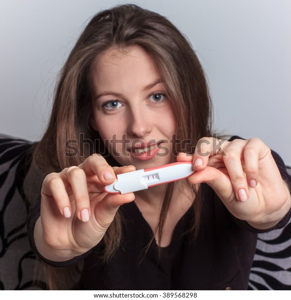 All 27+ Pictures stock photo obviously pregnant woman looking at a pregnancy test Stunning