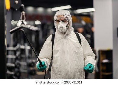 Close-up Shot Of A Worried Male Person In A Protective Suit With Goggles And Mask. He Committed To Winning Coronavirus In Gym Place. COVID19 Prevention, Pandemic Situation, Social Distance, New Normal