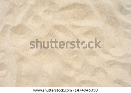 Close-up Shot. Yellow beach sand texture as background.