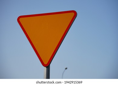 A Closeup Shot Of A Yellow Yield Sign