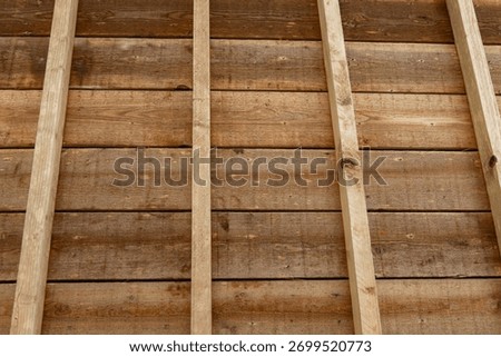 A close-up shows the assemblies and fixings of the framework.