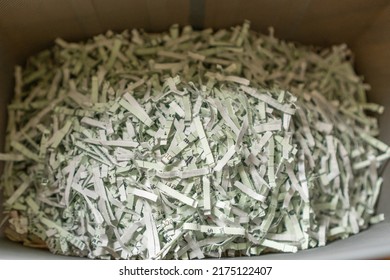 Close-up Of Shredded Paper In Paper Shredder Bin In Home Office.