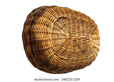 closeup of the side corner of this serving hood or rice cover made from oval-shaped woven rattan which is a typical Indonesian craft product. isolated on white