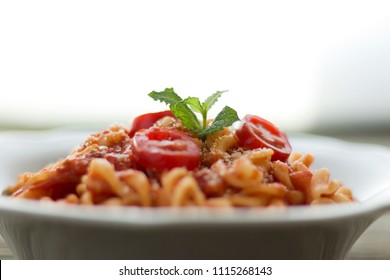 Close-up, Side View Of A Bowl Of Fusilli Pasta With Tomato Sauce. Shot With Shallow Depth-of-field.